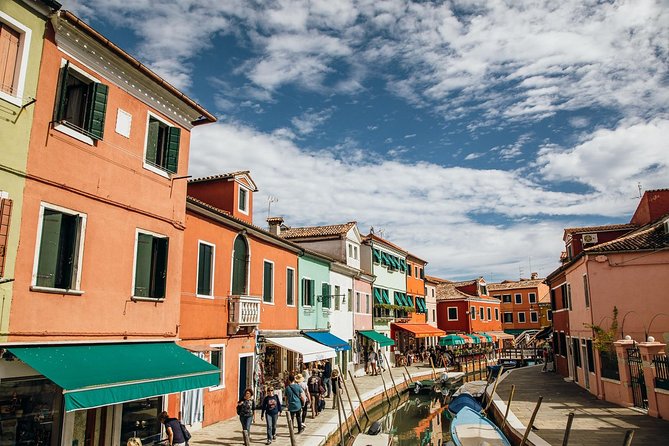 Murano Burano Islands Boat Tour Glass Factory & St Erasmo Winery - Stop 3: Burano’s colorful houses, lace roots, and guided canals