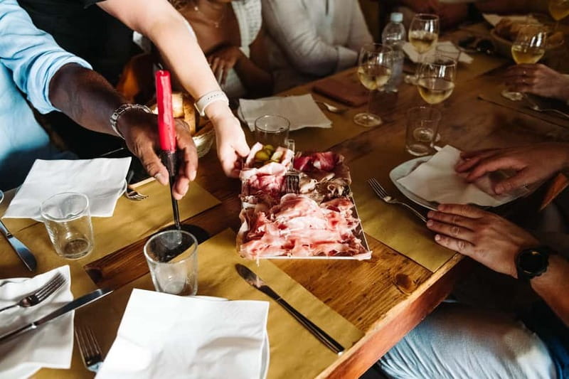 Venice: Eat & Drink Like a Local – Evening Cicchetti Tour - Cold cuts and prosecco in a renovated Venetian setting