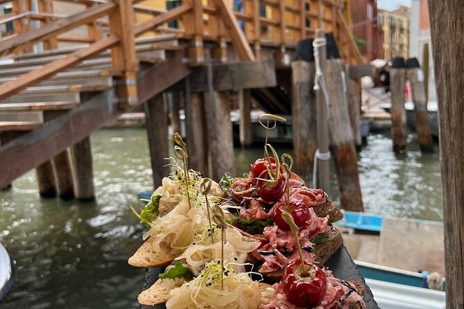 Venice Food Tour with 6+ Tastings with Cicchetti, Spritz & More - The Ex Cinema Teatro Italia start: where ornate Venice meets everyday shopping