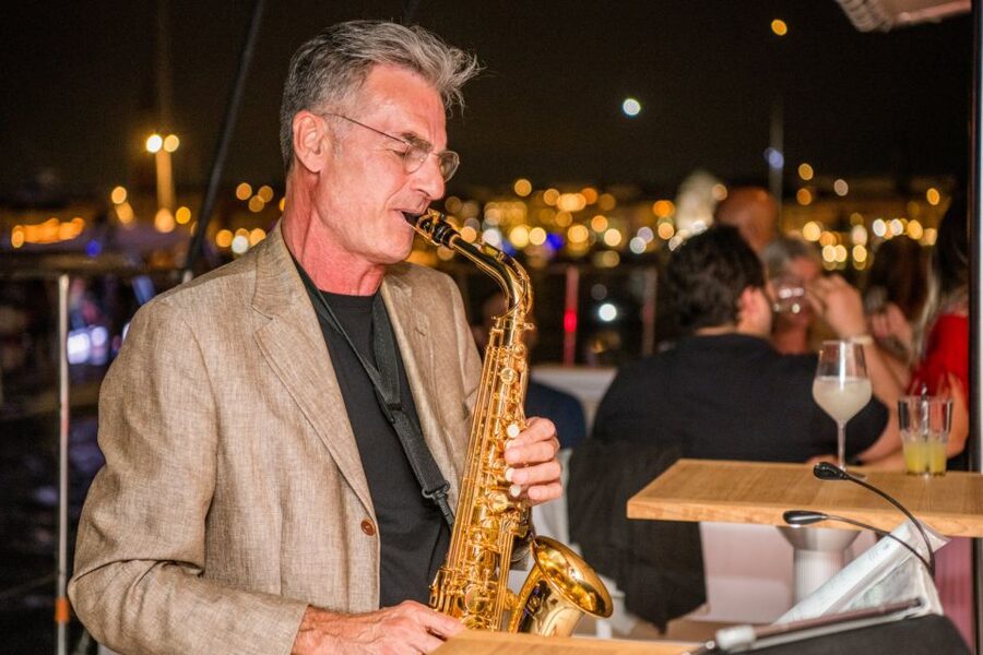 Venice: Night Catamaran Cruise of the Lagoon - Venice by night, with live tenor saxophone on the water